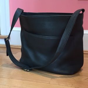 Dark green Coach hobo shaped bag.